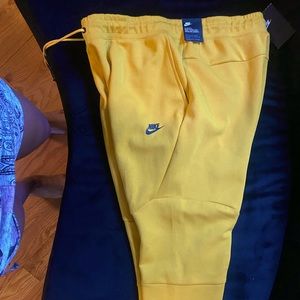 Yellow Nike Tech sweatpants never worn new with tags open to reasonable offers.